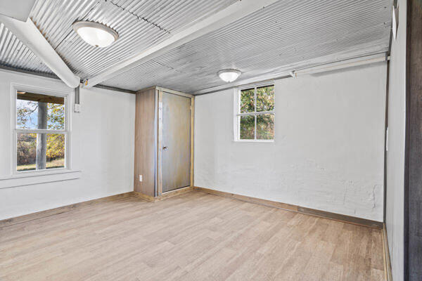 spare room with light hardwood / wood-style floors