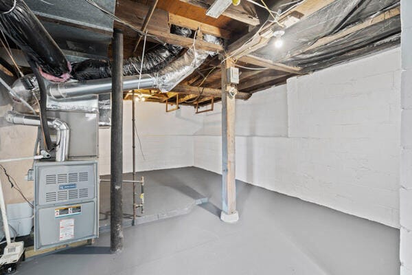201 N Evans St, Armstrong, MO 65230 - unfinished below grade area with concrete block wall and heating unit