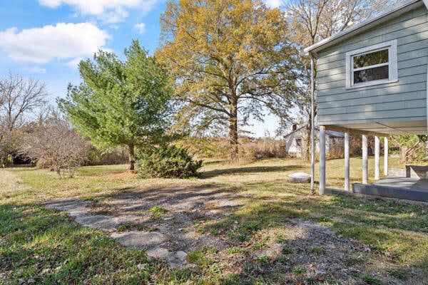 view of yard featuring a wooden deck