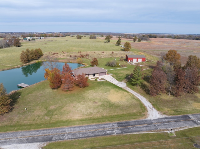 drone / aerial view with a water view and a rural view