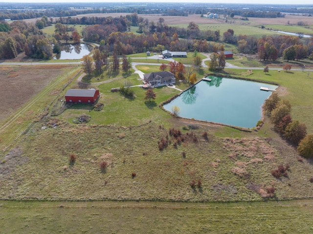 aerial view with a rural view and a water view