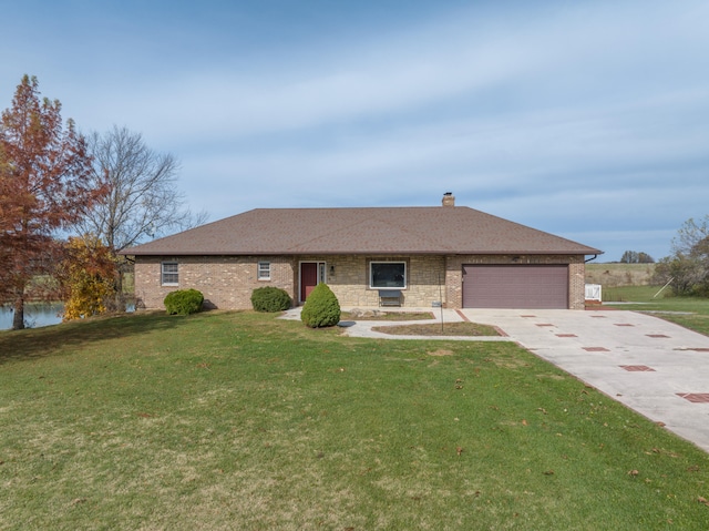 single story home with a garage and a front yard