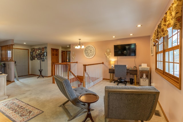 living room featuring a chandelier and light carpet