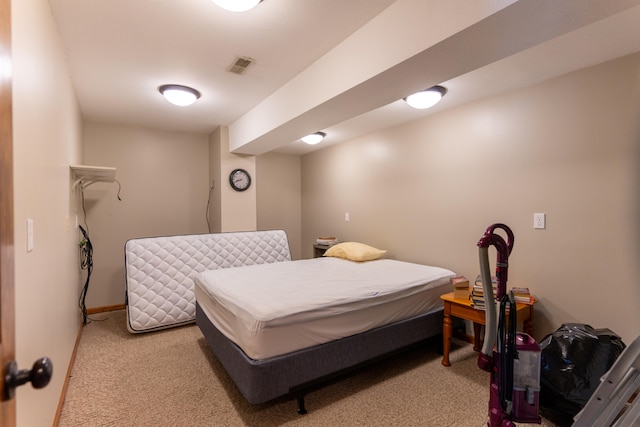 bedroom with light colored carpet