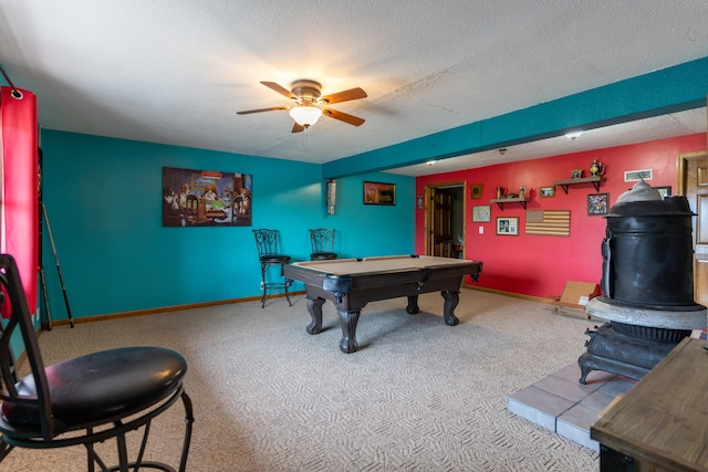 rec room with pool table, a textured ceiling, carpet flooring, and ceiling fan