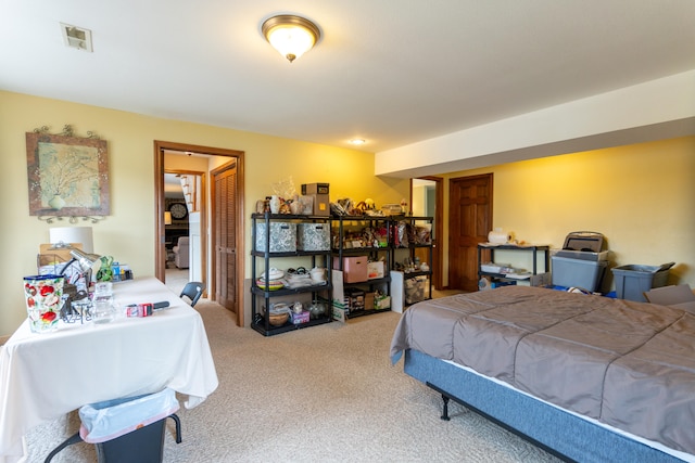 bedroom featuring light colored carpet