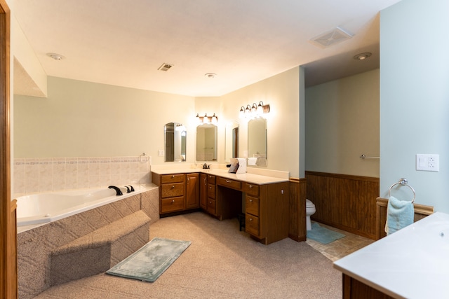 bathroom featuring vanity, toilet, and a bathtub