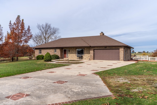 ranch-style home featuring a garage and a front yard