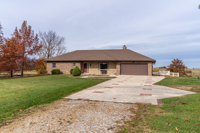 ranch-style home with a garage and a front yard