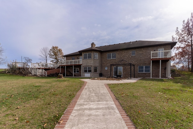 back of house with a lawn