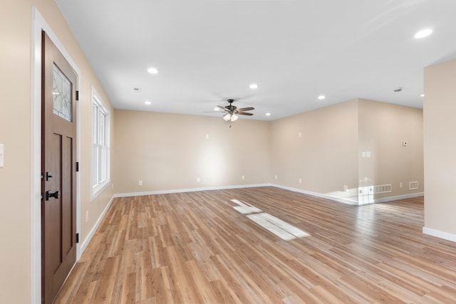 spare room with ceiling fan and light hardwood / wood-style floors