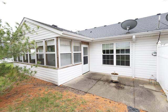 back of property with a patio