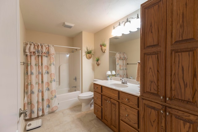 full bathroom with vanity, shower / tub combo, and toilet