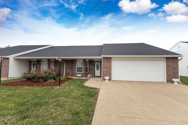 single story home featuring a garage and a front lawn