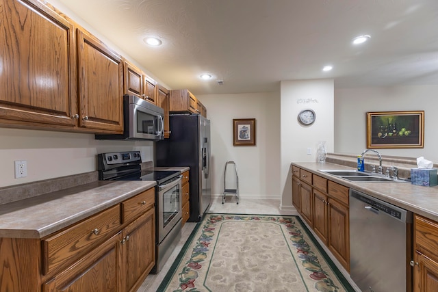 kitchen with sink and appliances with stainless steel finishes