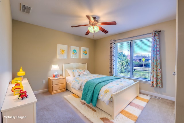 carpeted bedroom featuring ceiling fan