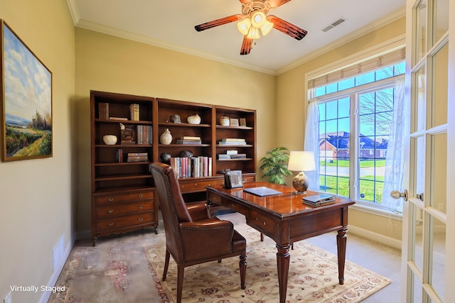 office space featuring light carpet, ceiling fan, and crown molding