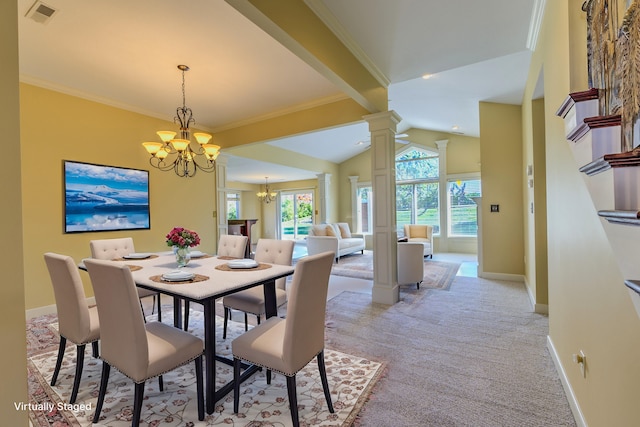 dining space with decorative columns, crown molding, a chandelier, and light colored carpet