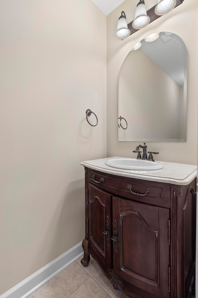 bathroom with tile patterned flooring and vanity