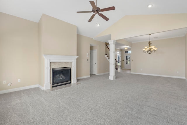 unfurnished living room with ceiling fan with notable chandelier, crown molding, vaulted ceiling, light colored carpet, and decorative columns