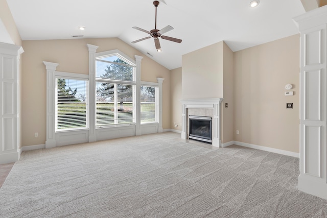 unfurnished living room featuring light carpet, a fireplace, ceiling fan, and lofted ceiling