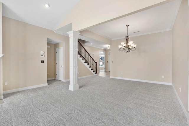 empty room with light carpet, an inviting chandelier, crown molding, and ornate columns