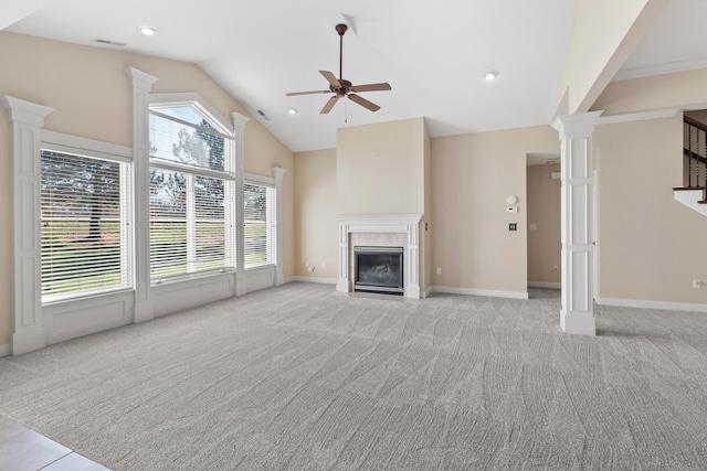 unfurnished living room with light carpet, ornate columns, ceiling fan, and lofted ceiling