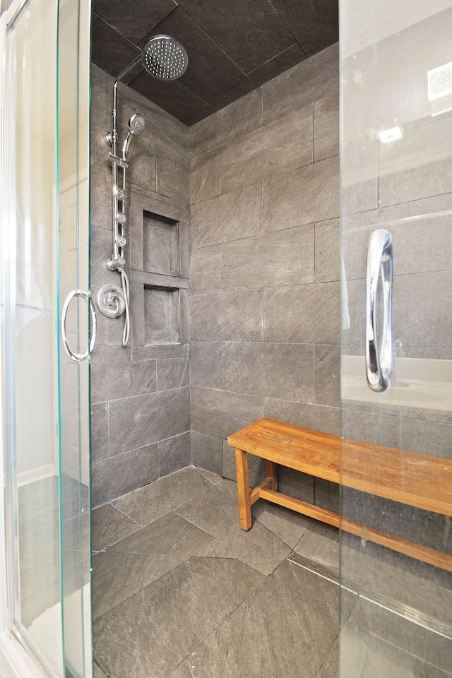 bathroom with a shower with shower door