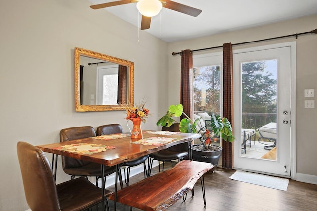 dining area featuring dark hardwood / wood-style flooring and ceiling fan