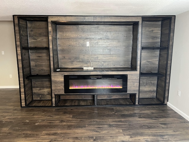 interior details with hardwood / wood-style flooring, a fireplace, and a textured ceiling