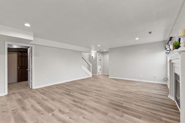 unfurnished living room with light wood-type flooring