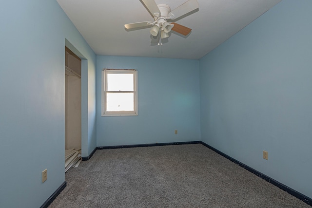 carpeted empty room with ceiling fan