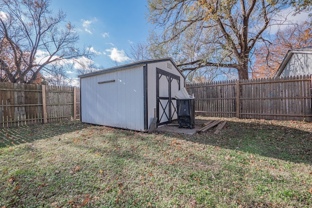 view of outbuilding featuring a yard