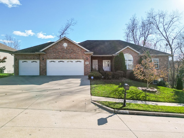 ranch-style house featuring a garage and a front lawn