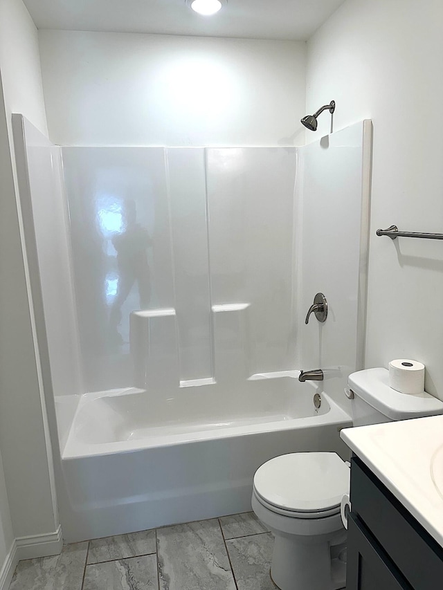 full bathroom with toilet, vanity, and tub / shower combination