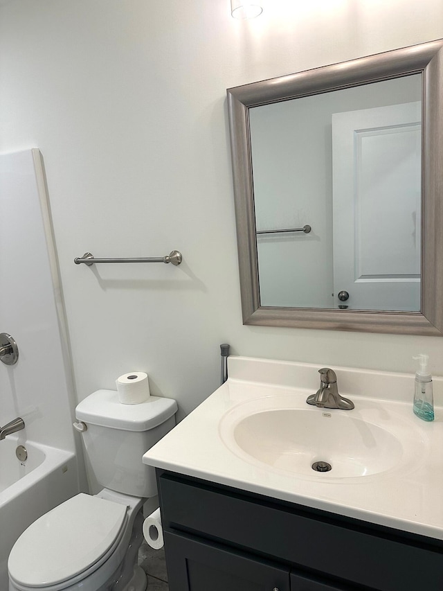 full bathroom with bathtub / shower combination, vanity, and toilet