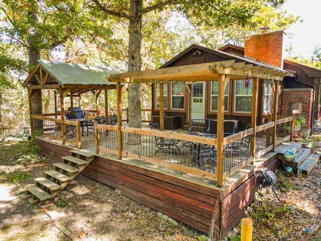 rear view of property with a wooden deck