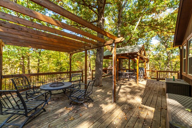 wooden deck featuring a pergola