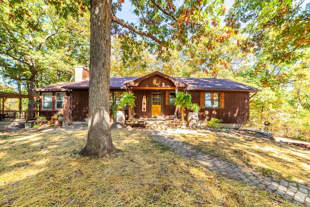 ranch-style home with a front lawn