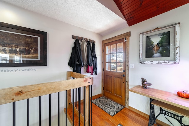 interior space featuring hardwood / wood-style flooring and a textured ceiling