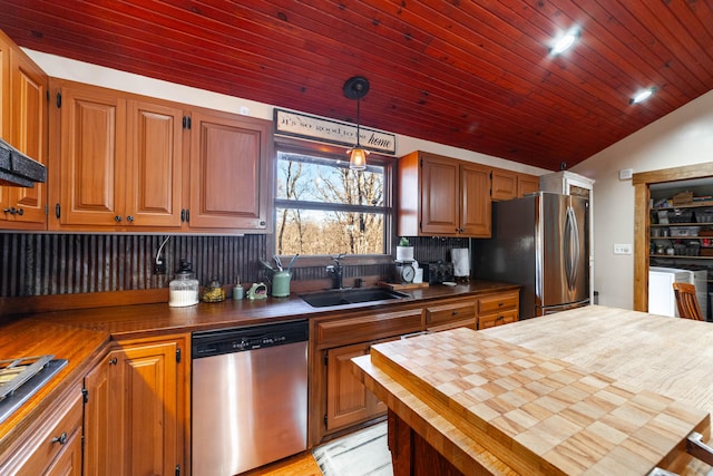 kitchen with stainless steel appliances, butcher block countertops, wood ceiling, sink, and pendant lighting