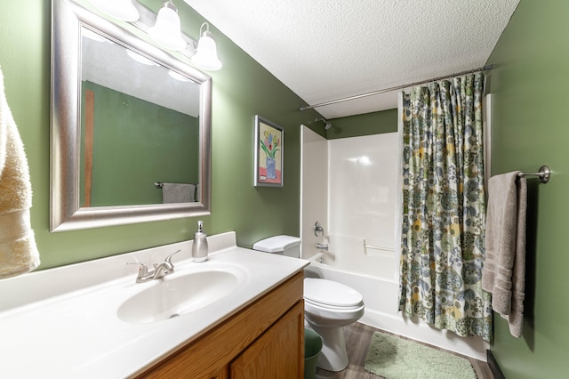 full bathroom with toilet, vanity, a textured ceiling, and shower / tub combo