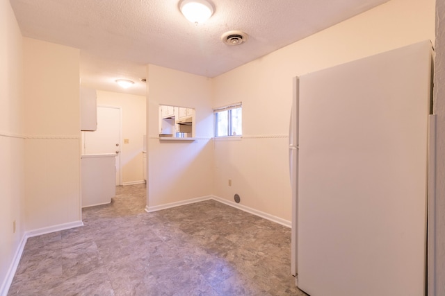 washroom featuring a textured ceiling