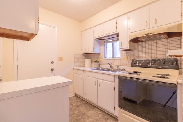 kitchen with tasteful backsplash, white cabinetry, sink, and white electric range oven