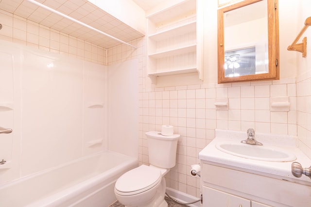 full bathroom featuring shower / bathtub combination, vanity, tile walls, and toilet