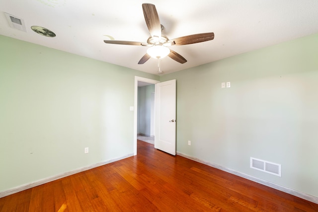 unfurnished room featuring ceiling fan and hardwood / wood-style floors