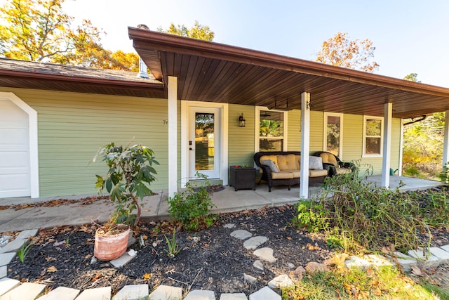 back of house with a porch and a garage