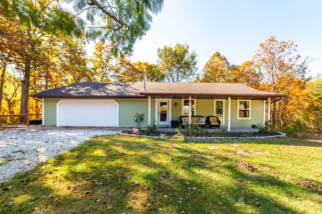 single story home featuring a porch, a garage, and a front lawn