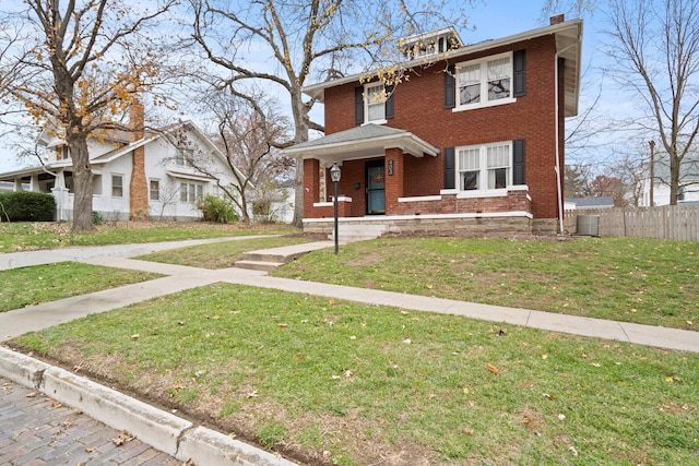 view of front of home featuring central AC and a front yard