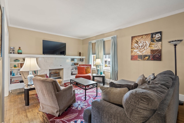 living room featuring a fireplace, hardwood / wood-style floors, and ornamental molding